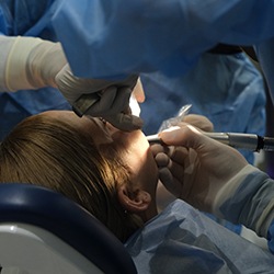 Woman getting dental surgery